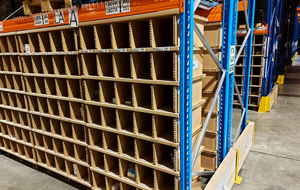 Warehouse storage units inserted in Metal racking